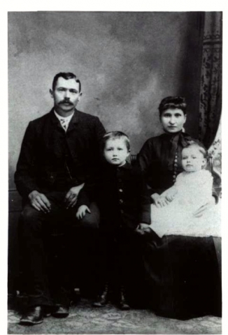John Francis Craw, !861-1913, Lelah Beatrice (Beckett)Craw, 1868-1954, parents of Kitty Pearl (Craw) Miles and sons Andrew Bernard, standing, Clarence Clinton, baby 